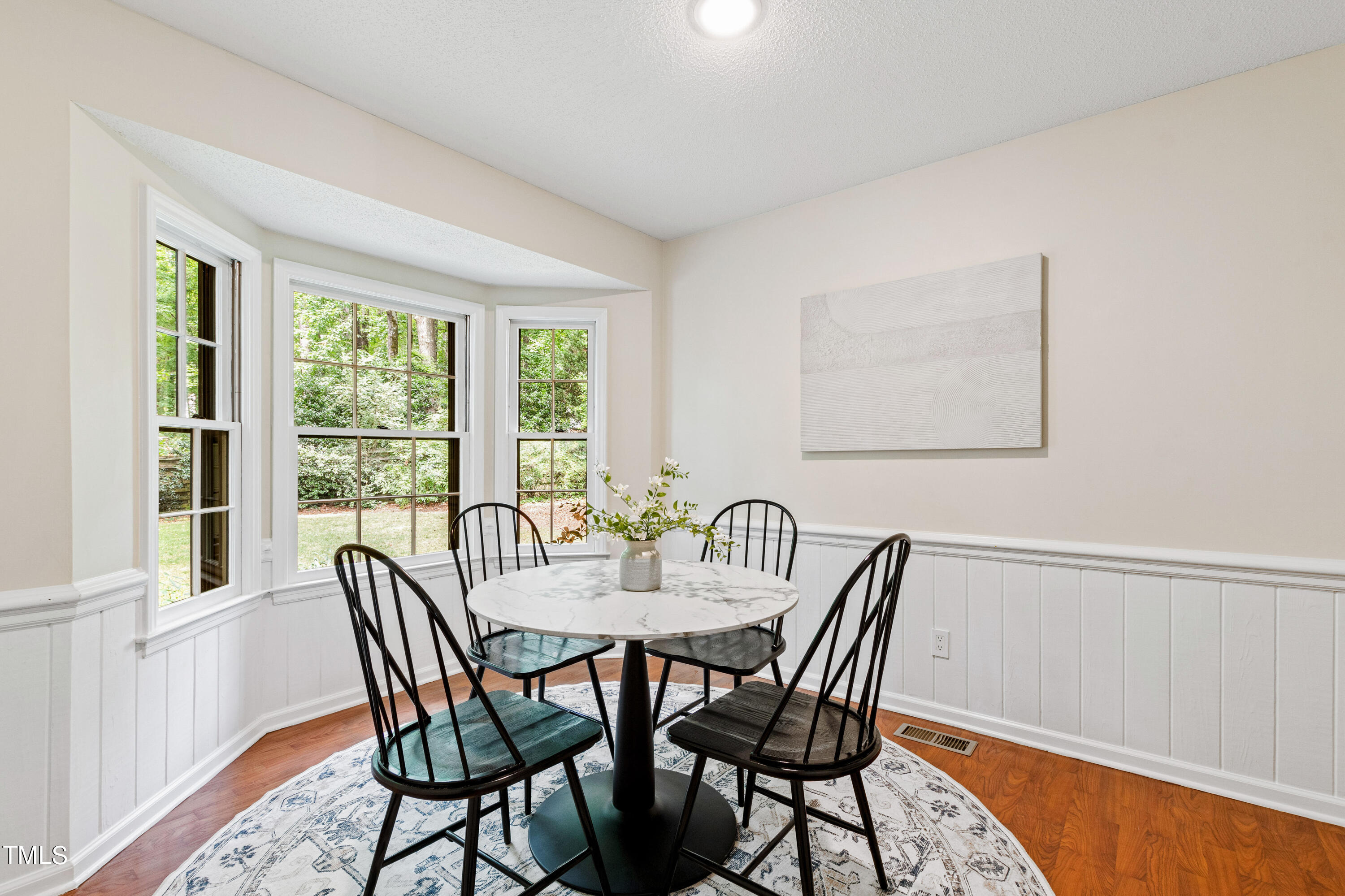 7801 Blackwing Court Raleigh, NC 27615 - Photo 20 of 40 a view of a dining room with furniture window and outside view