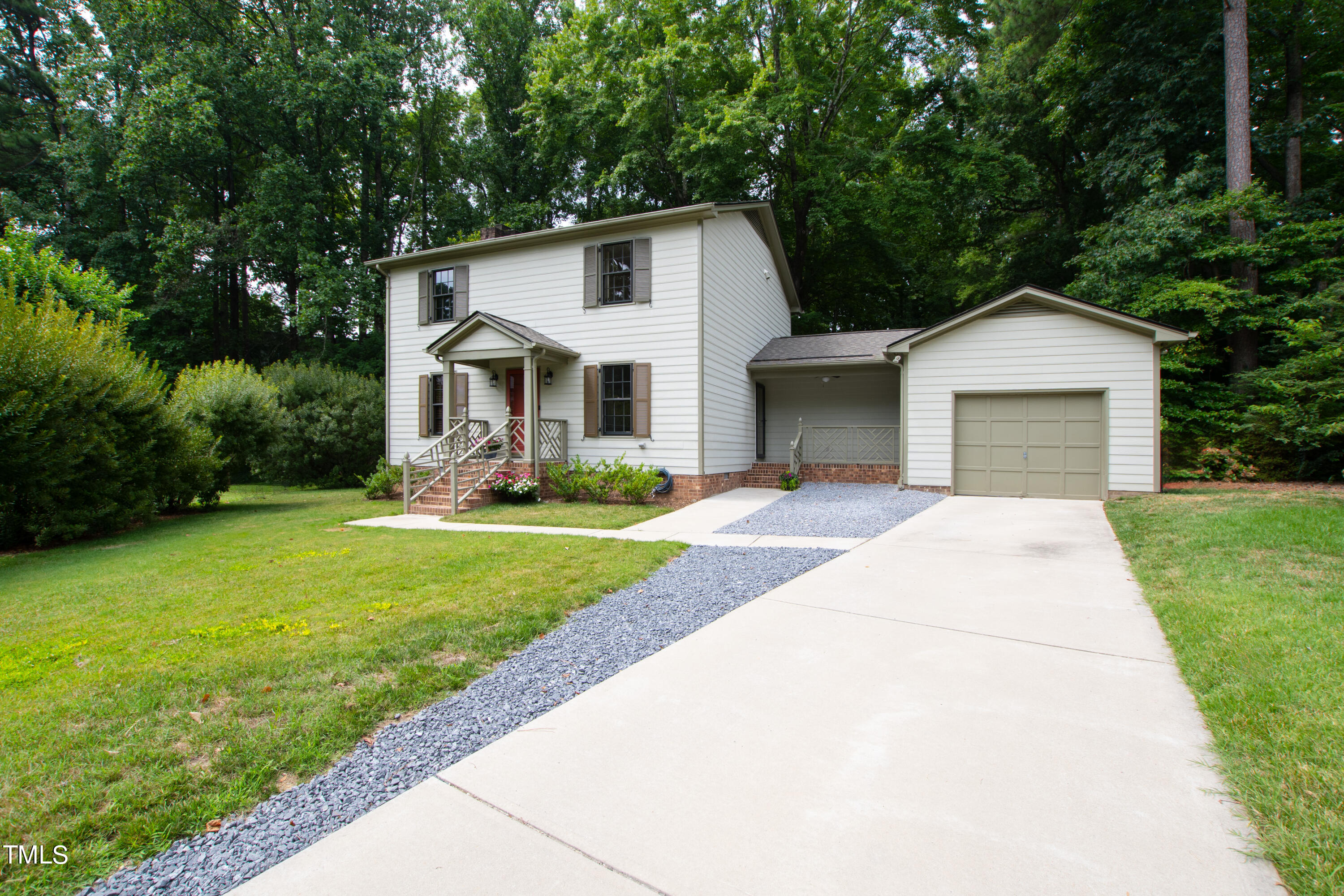 7801 Blackwing Court Raleigh, NC 27615 - Photo 2 of 40 a front view of a house with garden