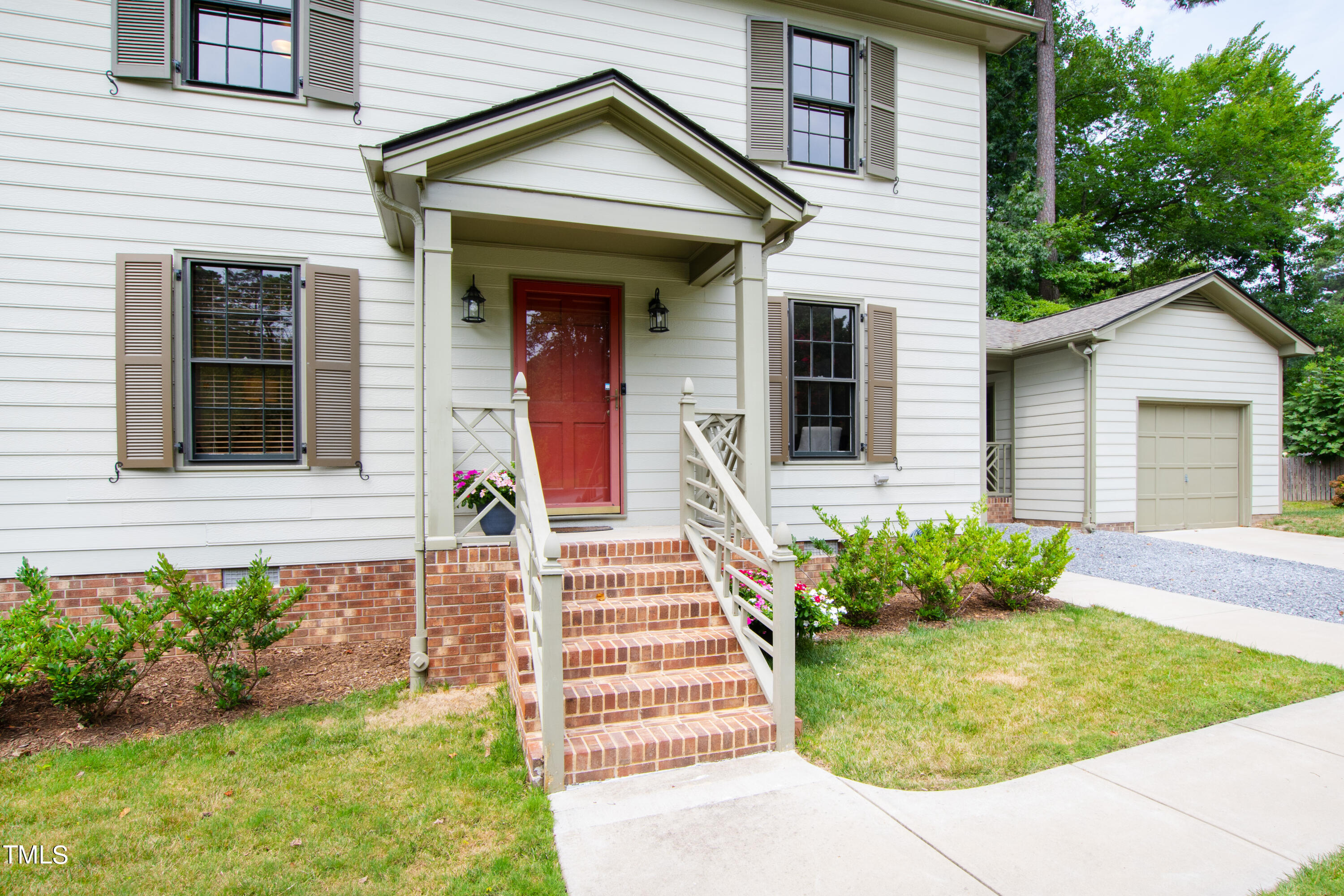 7801 Blackwing Court Raleigh, NC 27615 - Photo 3 of 40 a front view of a house with garden