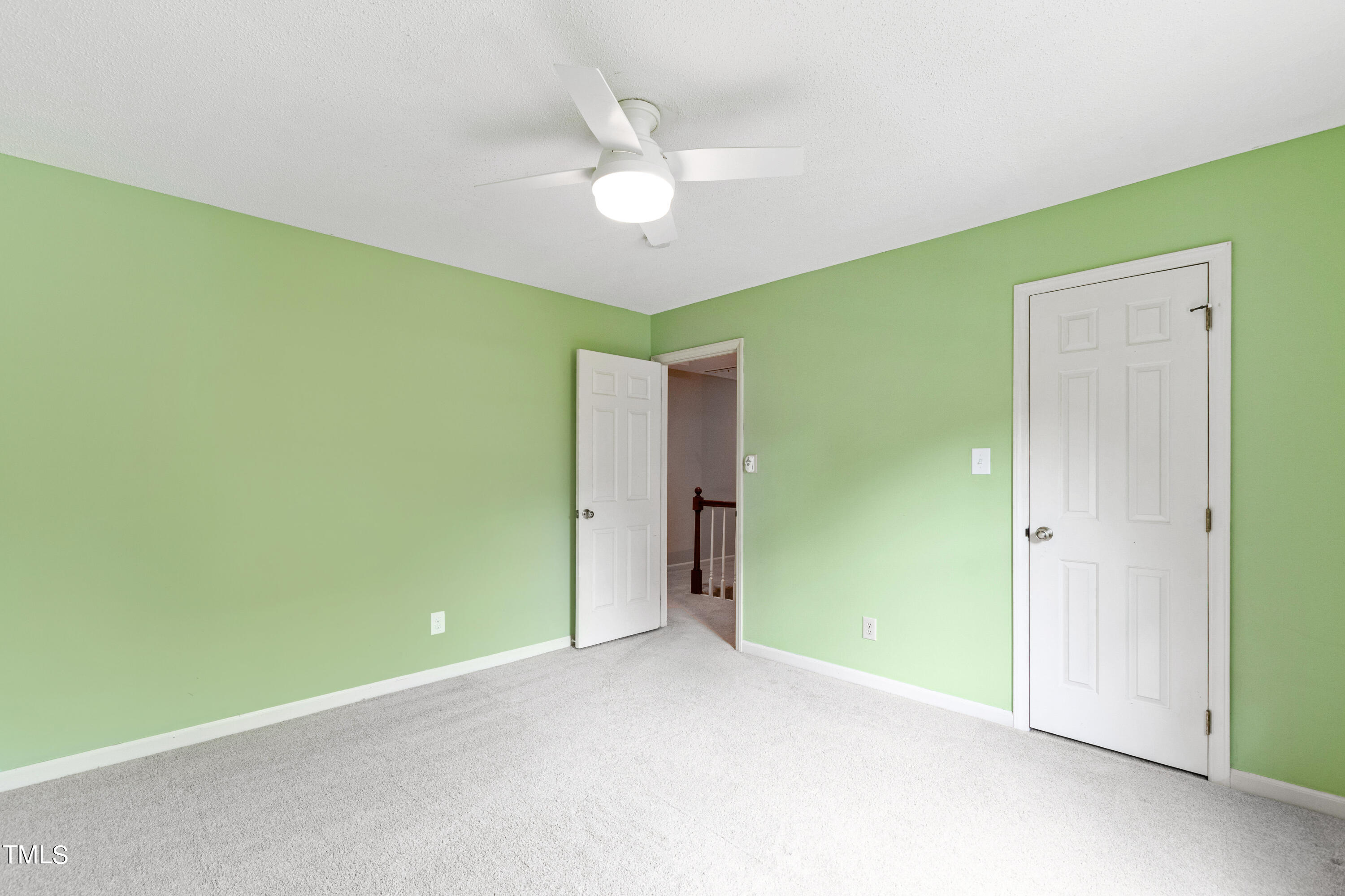 7801 Blackwing Court Raleigh, NC 27615 - Photo 36 of 40 a view of an empty room with a fan