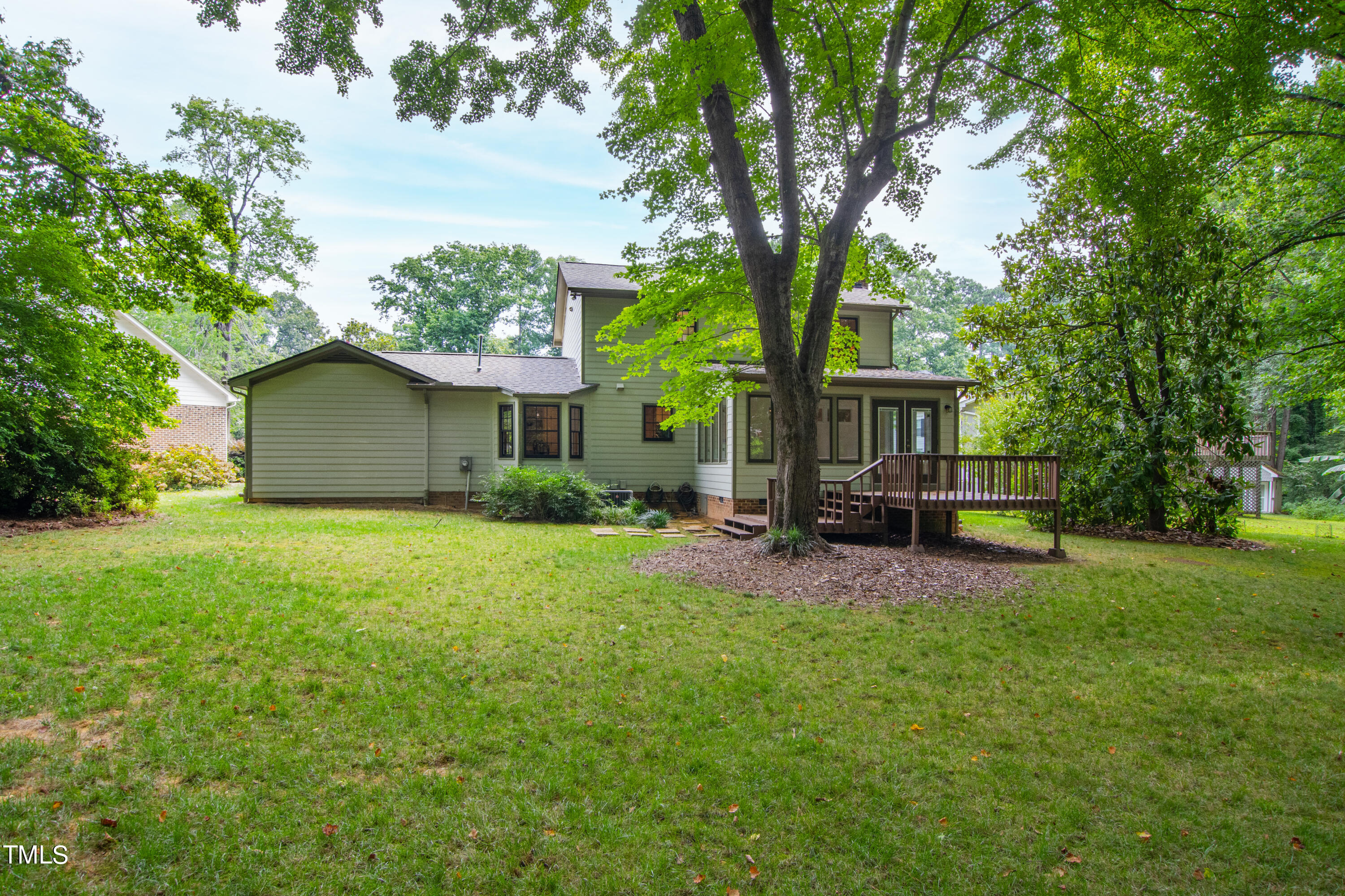 7801 Blackwing Court Raleigh, NC 27615 - Photo 38 of 40 a view of a house with backyard and a tree