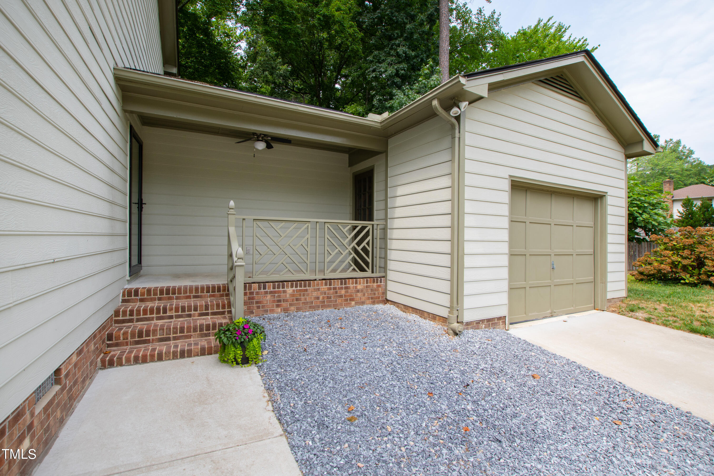 7801 Blackwing Court Raleigh, NC 27615 - Photo 4 of 40 a front view of a house with a garage