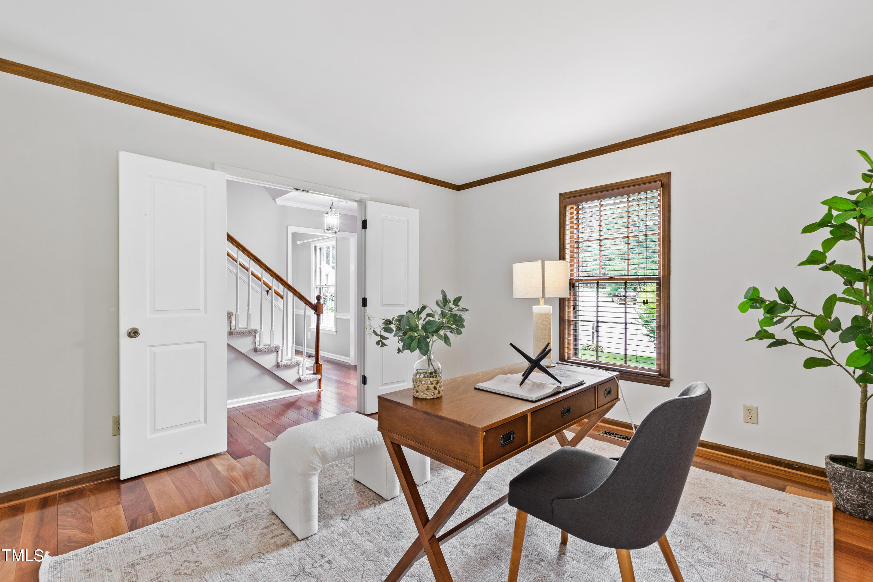 7801 Blackwing Court Raleigh, NC 27615 - Photo 8 of 40 a living room with furniture and wooden floor