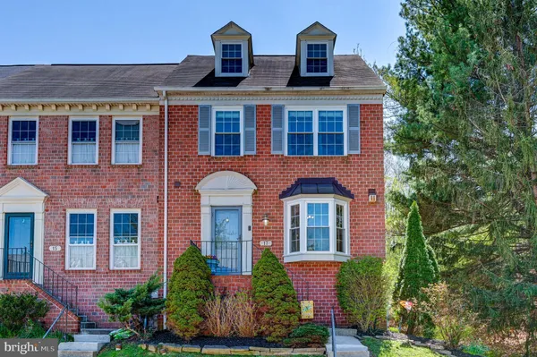 front view of brick house with a yard