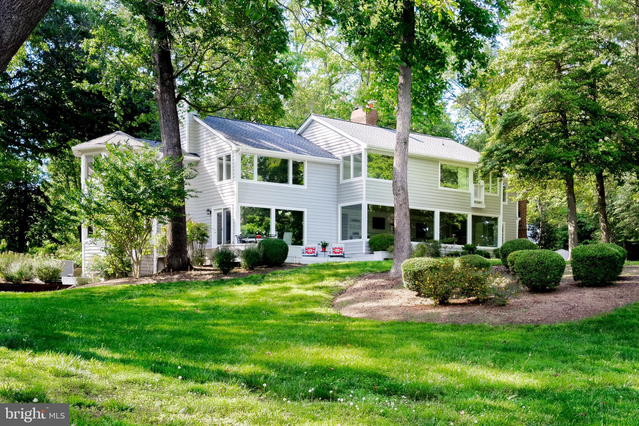 a view of a house with a yard porch and sitting area