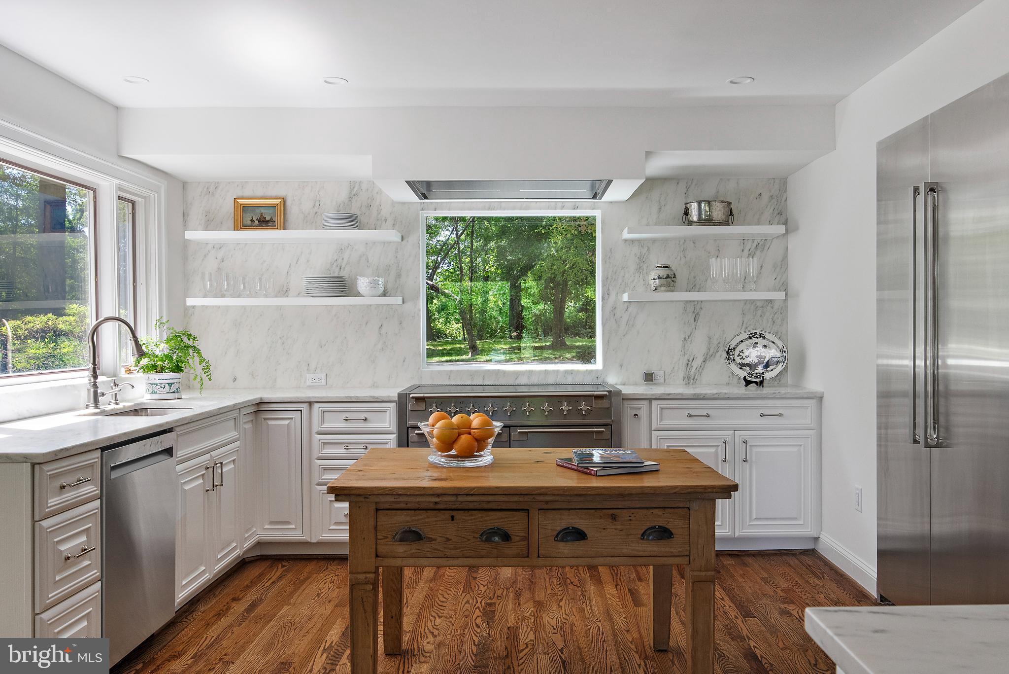 1879 Whitehall Road Annapolis, MD 21409 - Photo 14 of 78 a view of a kitchen with a stove a sink and wooden floor