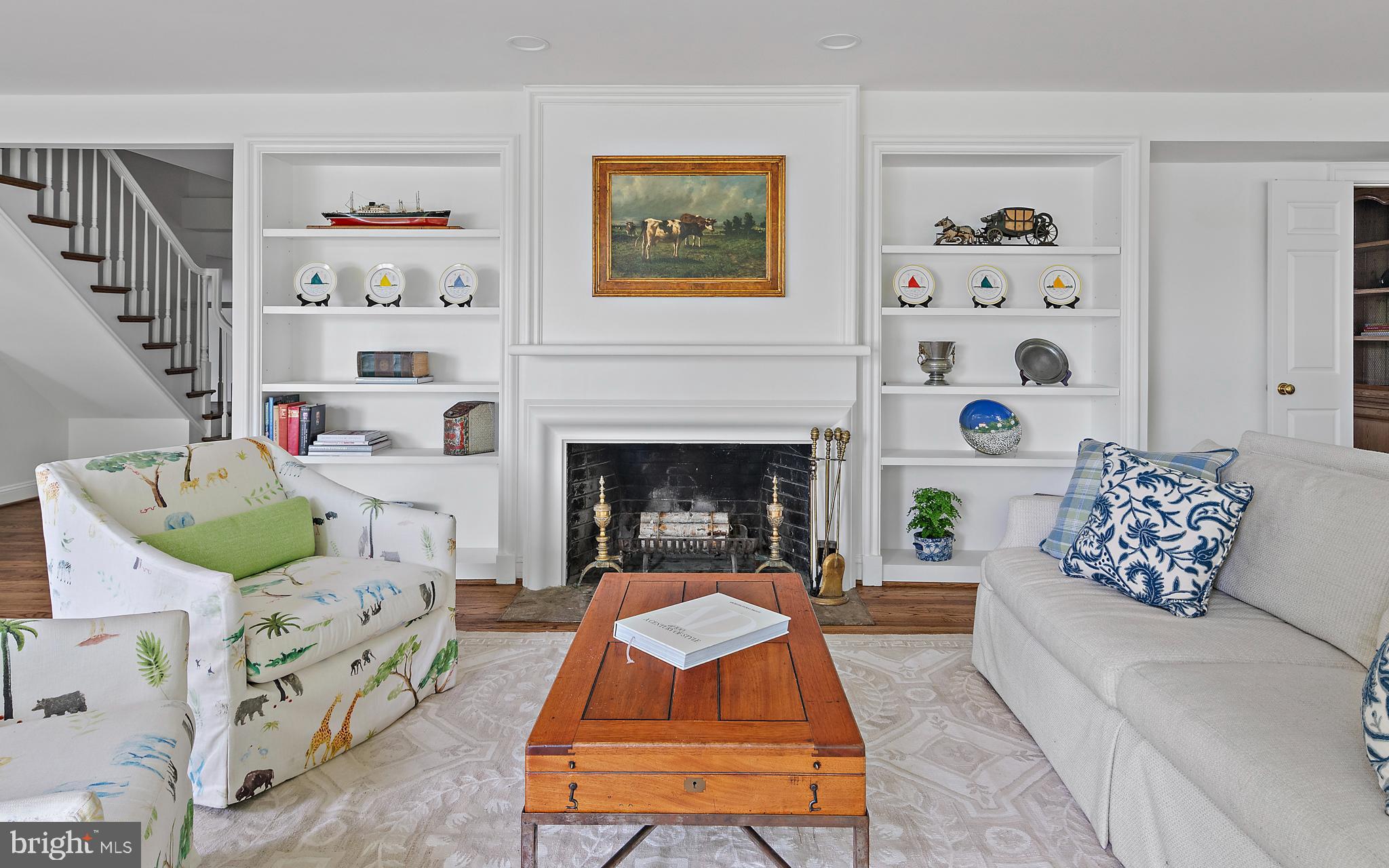 1879 Whitehall Road Annapolis, MD 21409 - Photo 19 of 78 a living room with furniture and a fireplace