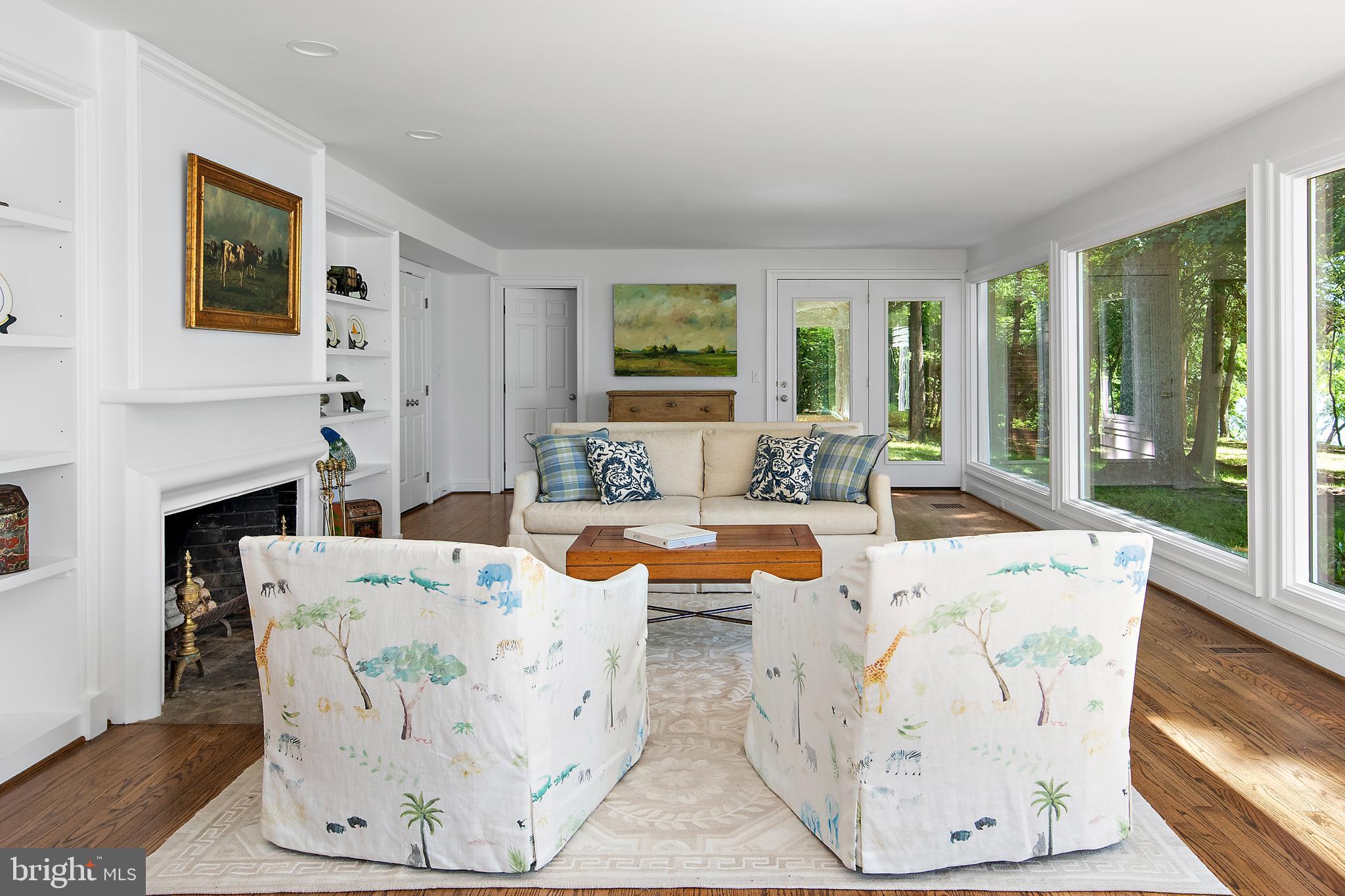 1879 Whitehall Road Annapolis, MD 21409 - Photo 20 of 78 a living room with fireplace furniture and a large window