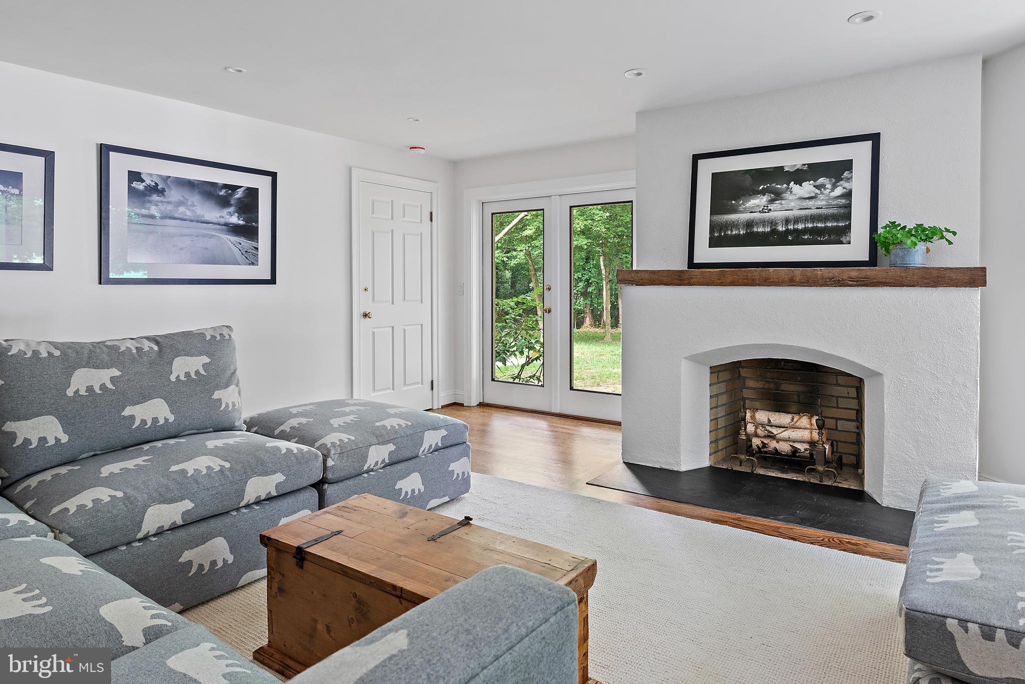 1879 Whitehall Road Annapolis, MD 21409 - Photo 29 of 78 a living room with furniture and a fireplace
