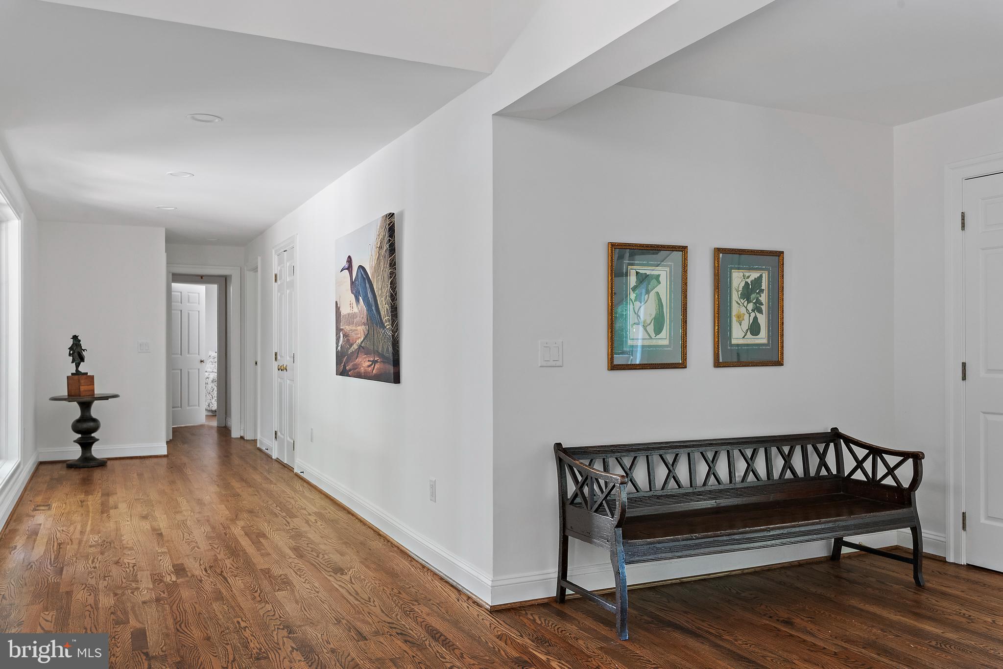 1879 Whitehall Road Annapolis, MD 21409 - Photo 32 of 78 a view of a hallway with wooden floor and a workspace