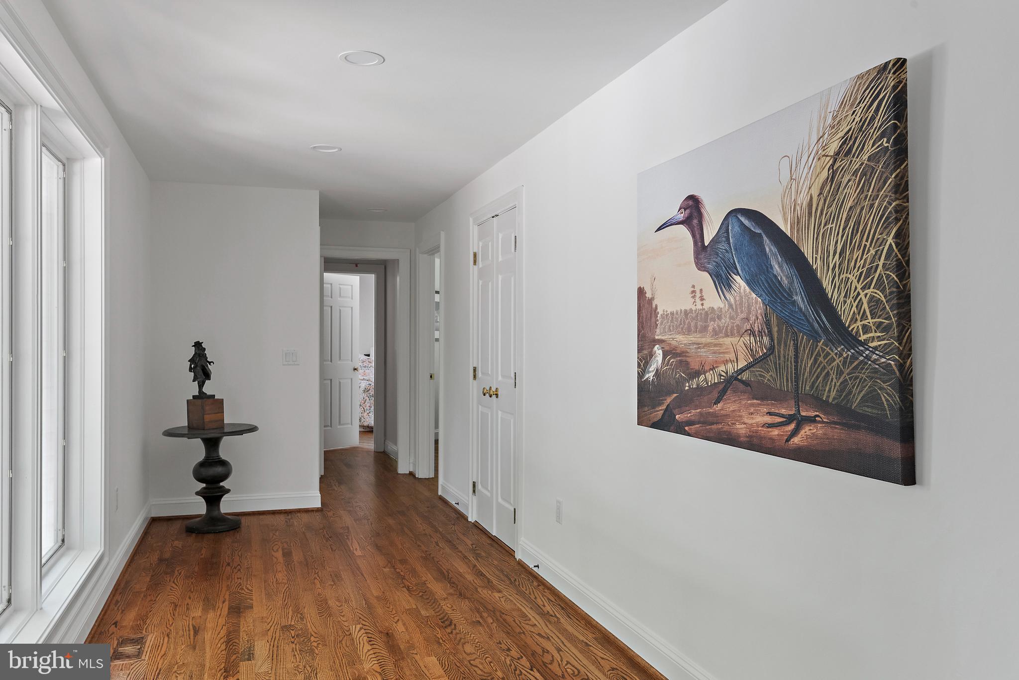 1879 Whitehall Road Annapolis, MD 21409 - Photo 33 of 78 a view of a hallway with wooden floor and workspace