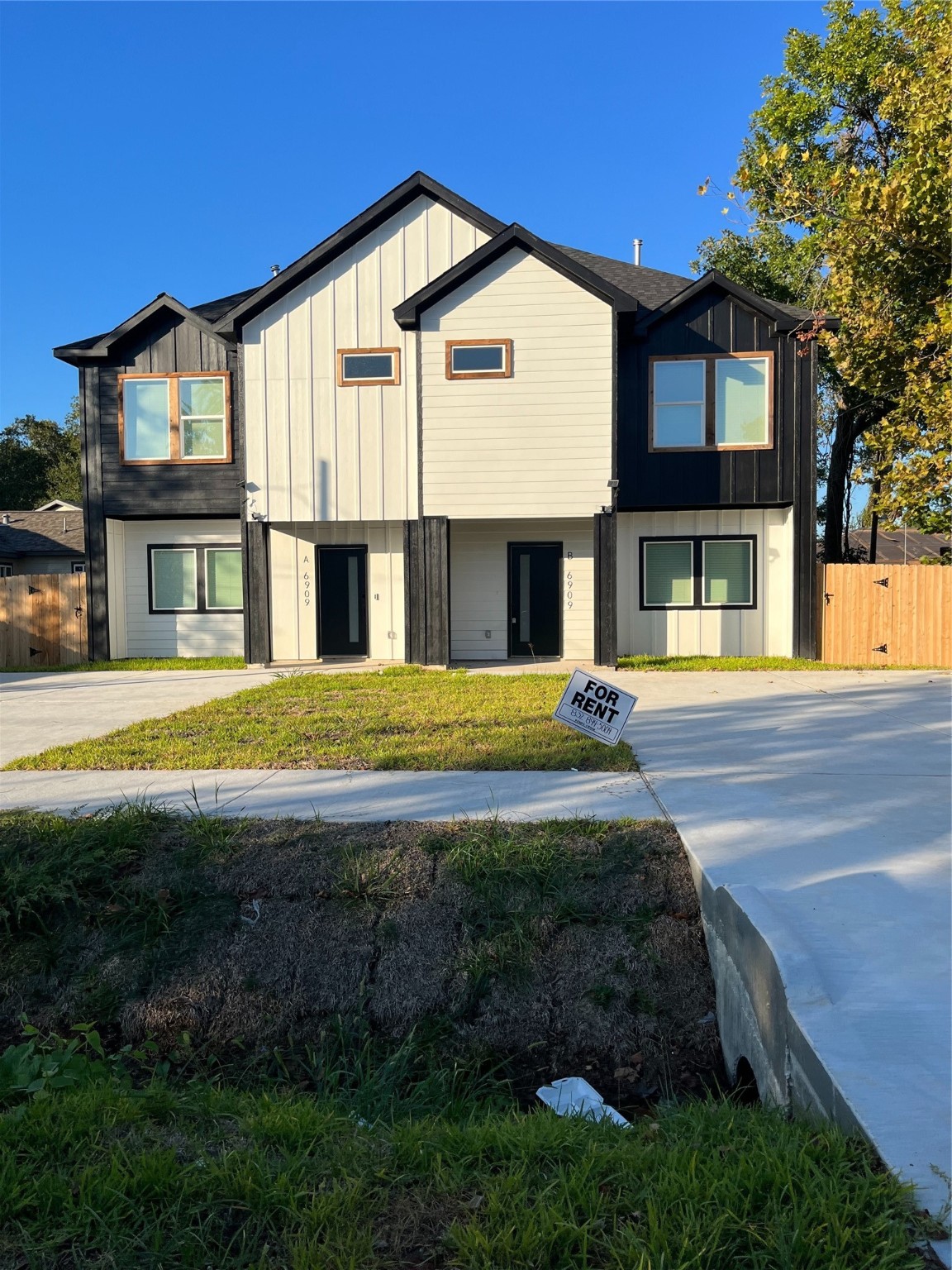 6908 South Hall Street Houston, TX 77028 - Photo 4 of 6 a front view of a house with a yard