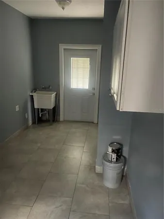 a view of room with window and pillar in it