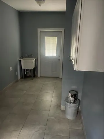 a view of room with window and pillar in it