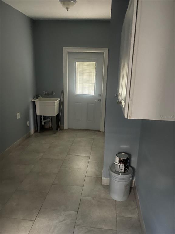8704 Jackson Springs Road Tampa, FL 33615 - Photo 14 of 21 a bathroom with a toilet and a window