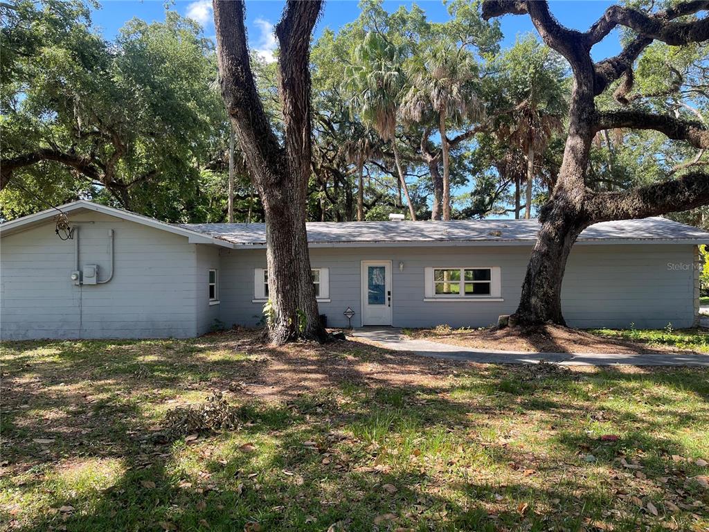 8704 Jackson Springs Road Tampa, FL 33615 - Photo 2 of 21 a view of a house with a yard