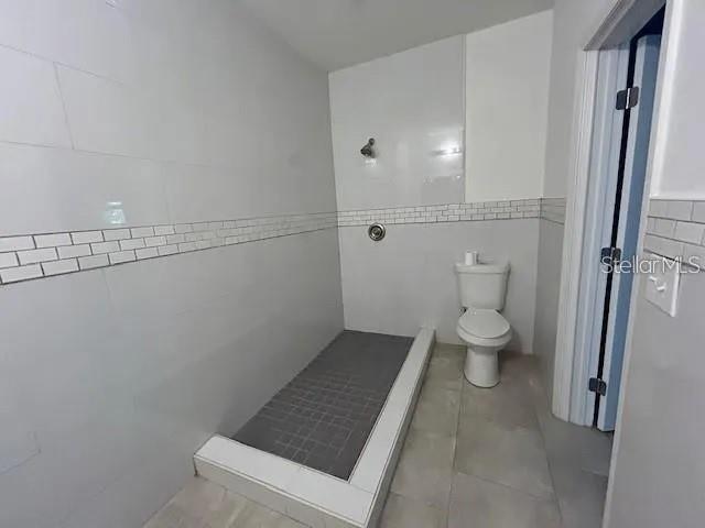 8704 Jackson Springs Road Tampa, FL 33615 - Photo 21 of 21 a bathroom with a toilet