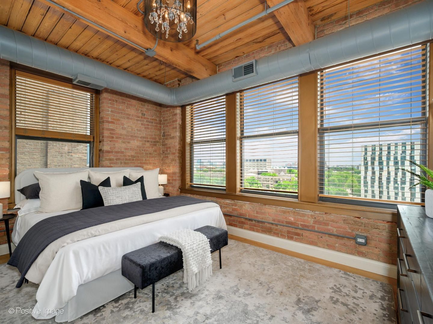 411 South Sangamon Street, Unit 7D Chicago, IL 60607 - Photo 12 of 20 a bed sitting in a bedroom next to a window