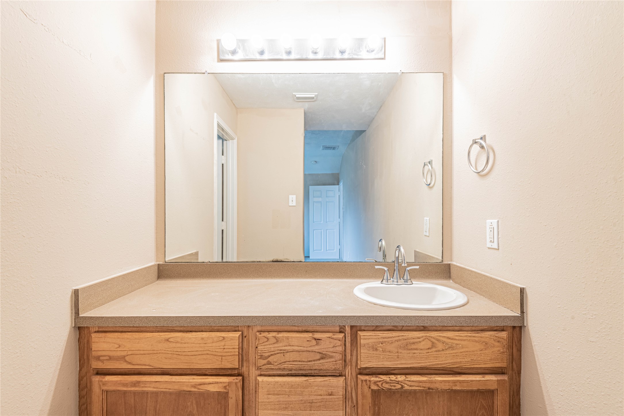 21135 Sprouse Circle Humble, TX 77338 - Photo 11 of 18 a bathroom with a sink and a mirror
