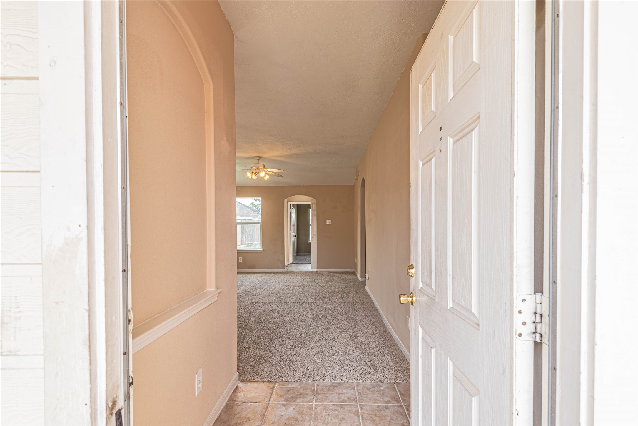 21135 Sprouse Circle Humble, TX 77338 - Photo 2 of 18 a view of a hallway with wooden floor