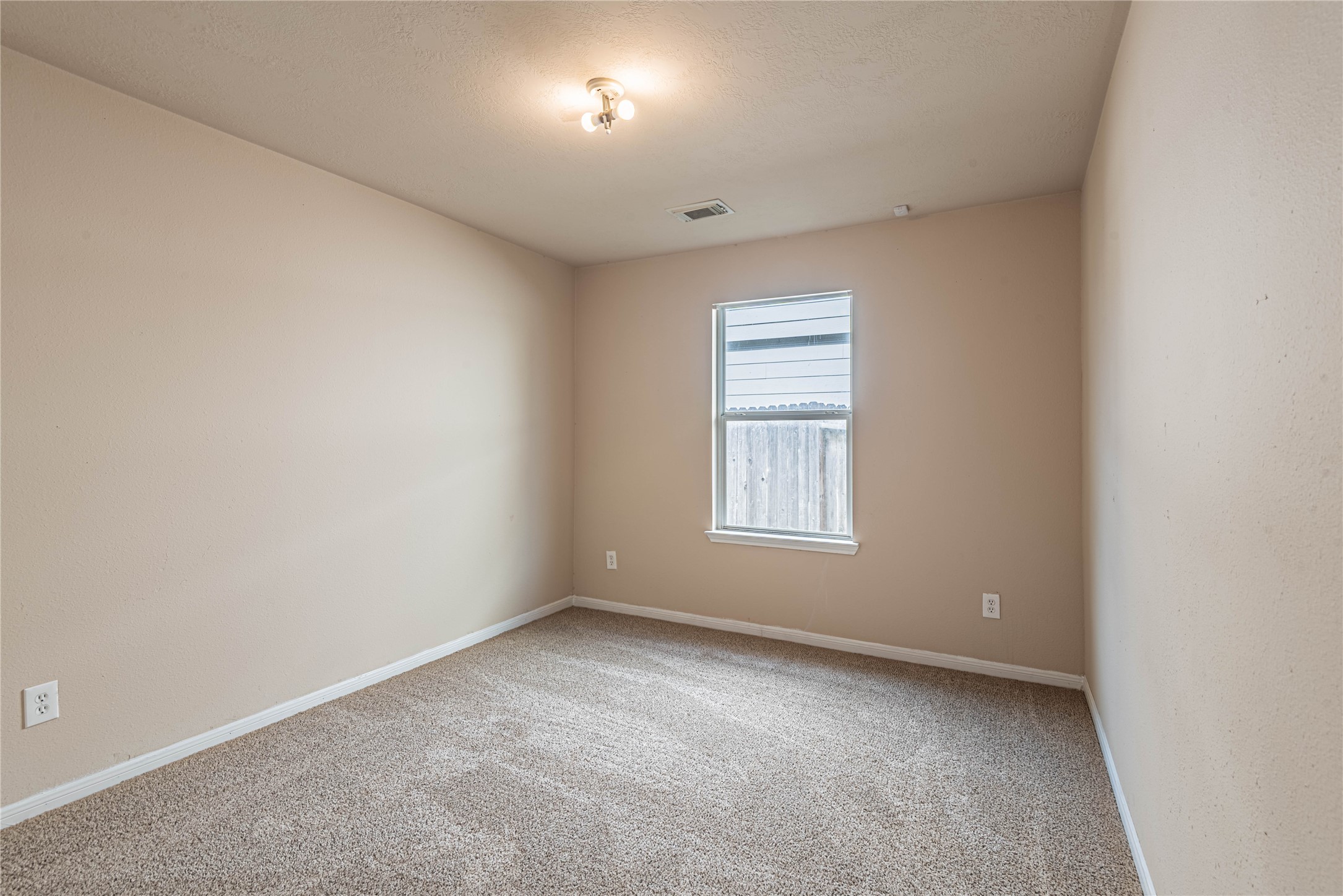 21135 Sprouse Circle Humble, TX 77338 - Photo 9 of 18 an empty room with a window