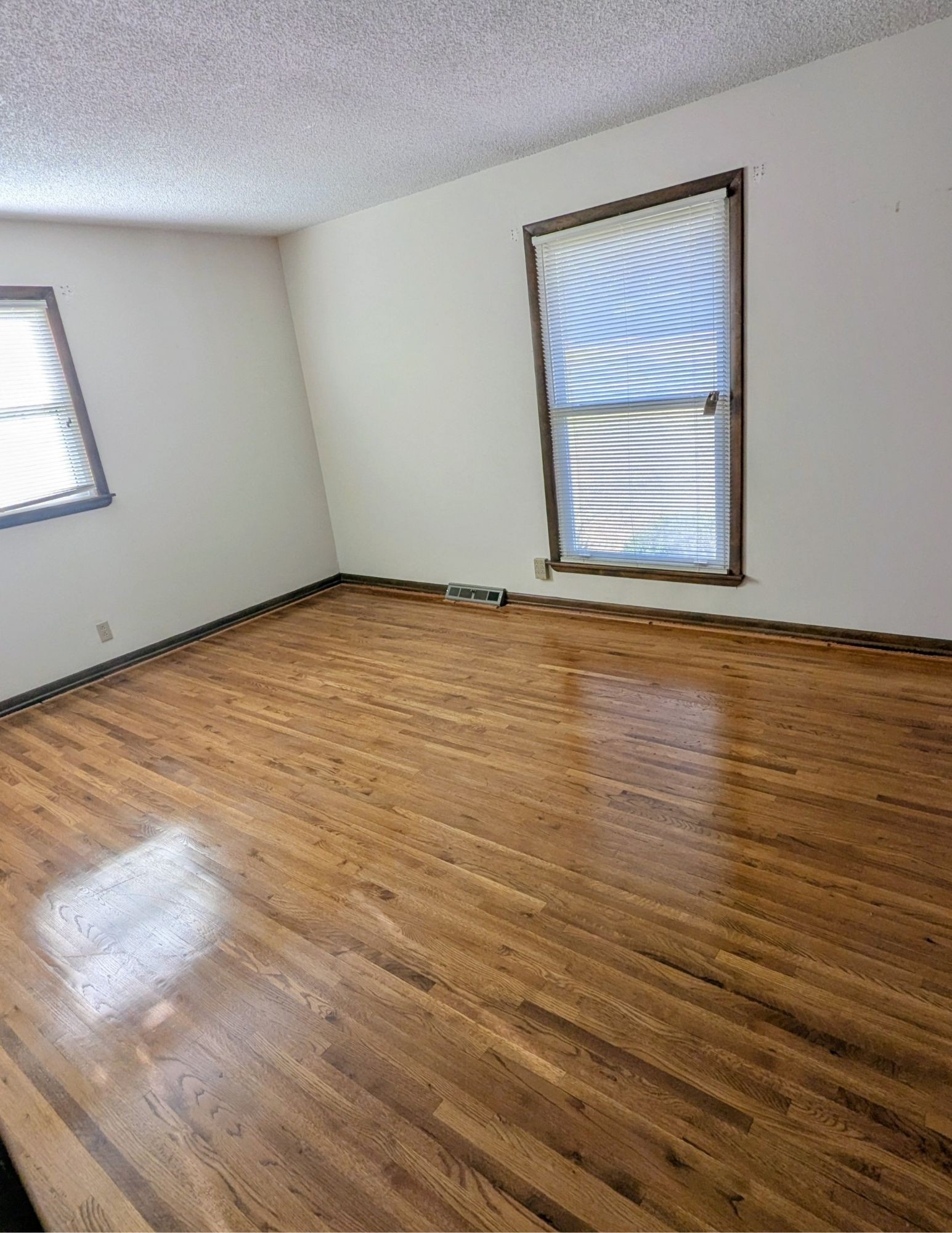 3042 Old Murfreesboro Road College Grove, TN 37046 - Photo 8 of 12 a view of an empty room with wooden floor and a window