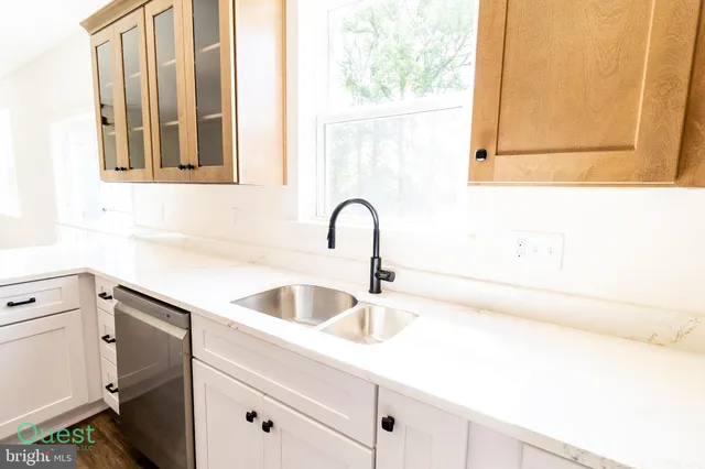a kitchen with a stove and a microwave