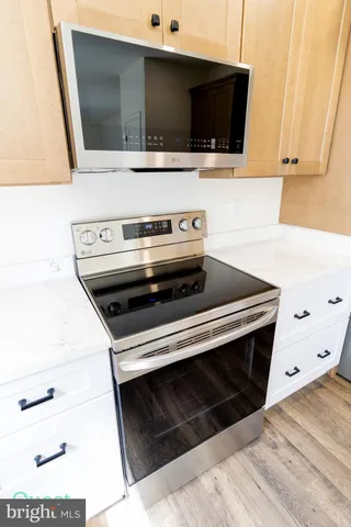 a view of an empty room and wooden floor