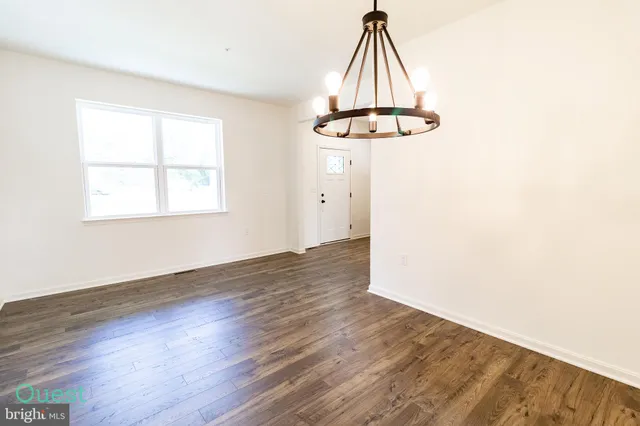 a kitchen with stainless steel appliances a stove microwave and cabinets