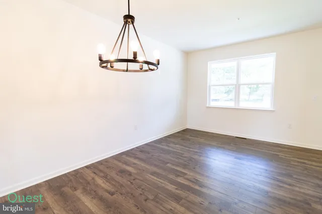 a kitchen with stainless steel appliances a stove a sink and a refrigerator
