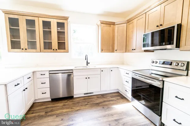 a kitchen with a sink and a window