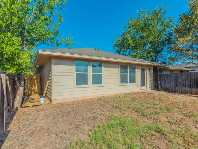 a house with trees in the background