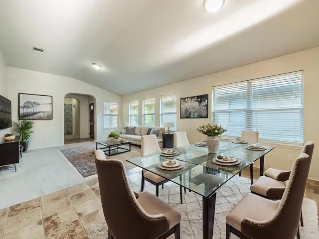 a view of a dining room with furniture