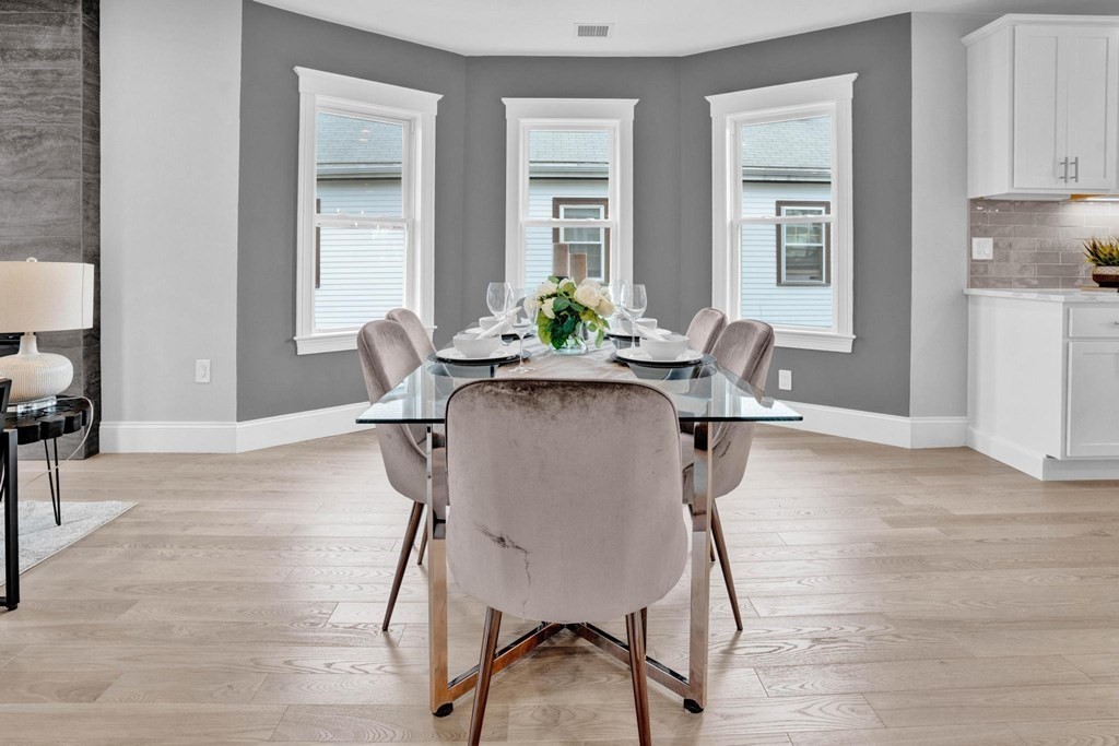 63 Kenmere Road, Unit 2 Medford, MA 02155 - Photo 12 of 42 a view of a dining room with furniture and a window