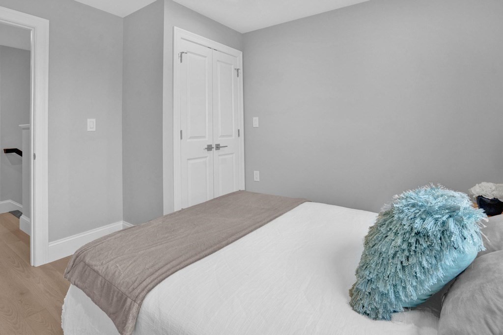 63 Kenmere Road, Unit 2 Medford, MA 02155 - Photo 26 of 42 a bedroom with a bed and a window