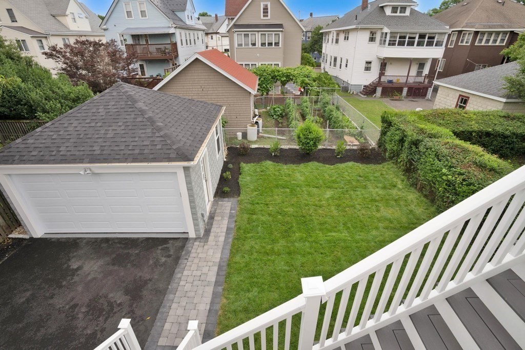 63 Kenmere Road, Unit 2 Medford, MA 02155 - Photo 36 of 42 a aerial view of a house with a yard