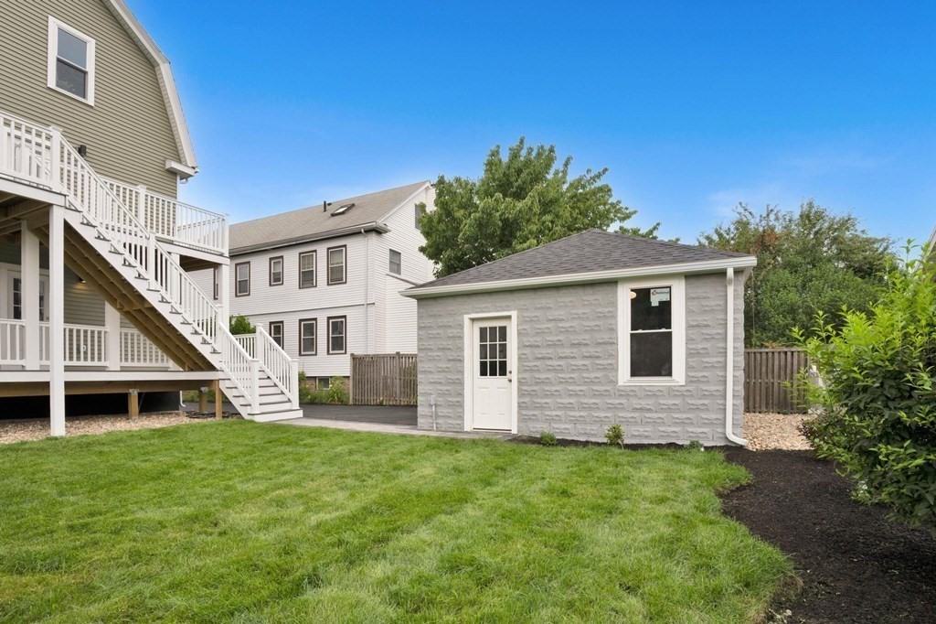63 Kenmere Road, Unit 2 Medford, MA 02155 - Photo 40 of 42 a view of a house with a yard