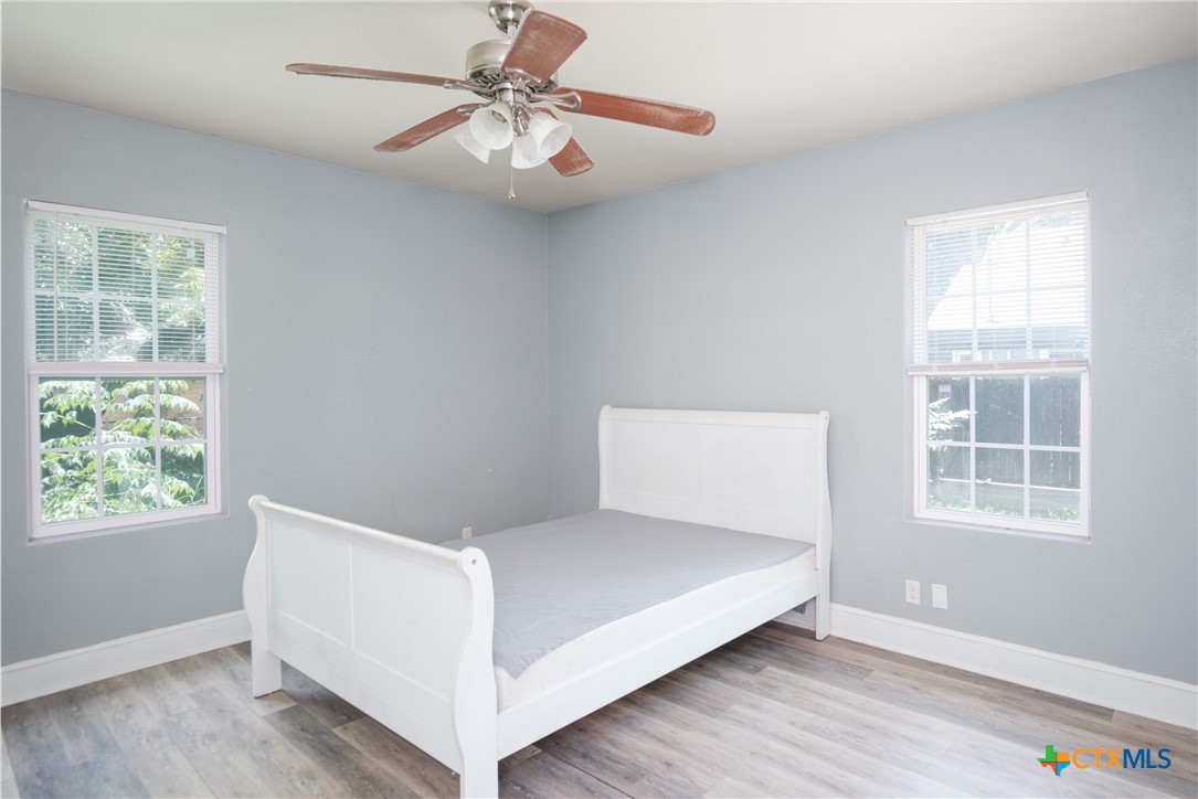 921 South 11th Street Temple, TX 76504 - Photo 12 of 23 a bedroom with a bed and a window