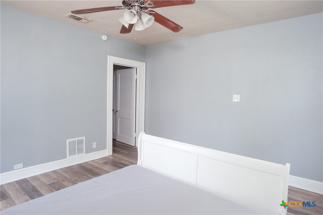 921 South 11th Street Temple, TX 76504 - Photo 14 of 23 a view of an empty room with a chandelier fan