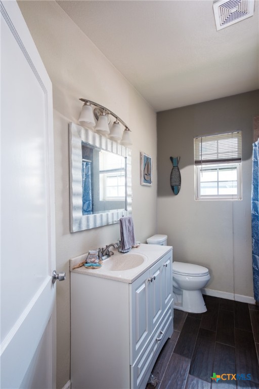 921 South 11th Street Temple, TX 76504 - Photo 17 of 23 a bathroom with a sink toilet and window