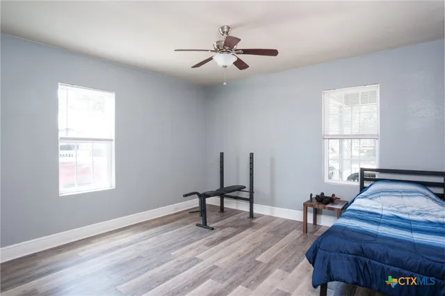 a view of a livingroom with furniture and a window