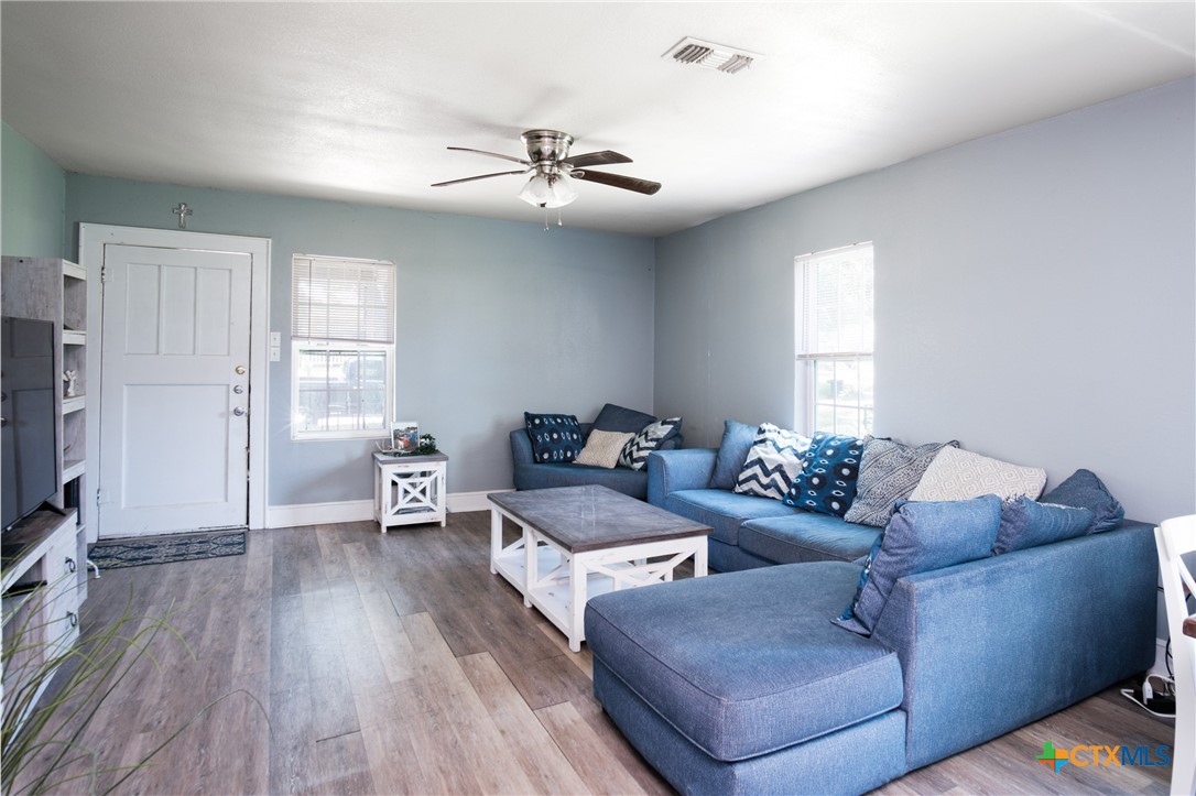 921 South 11th Street Temple, TX 76504 - Photo 6 of 23 a living room with furniture and a flat screen tv