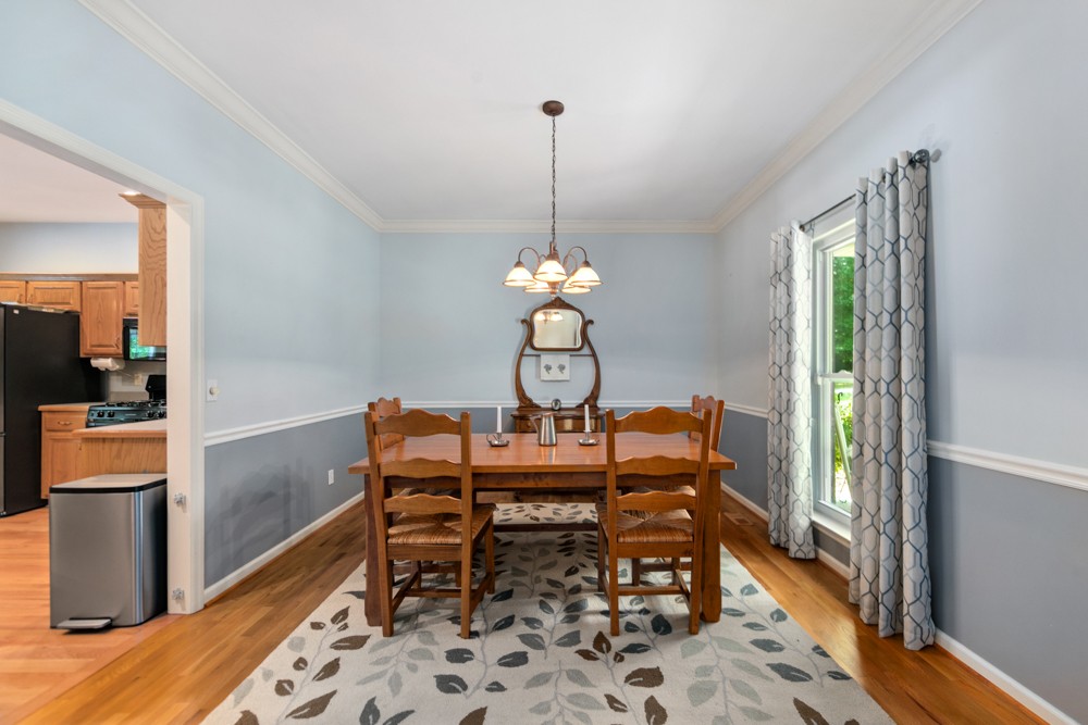 105 Spicer Road Burns, TN 37029 - Photo 13 of 44 a dining room with a table and chairs