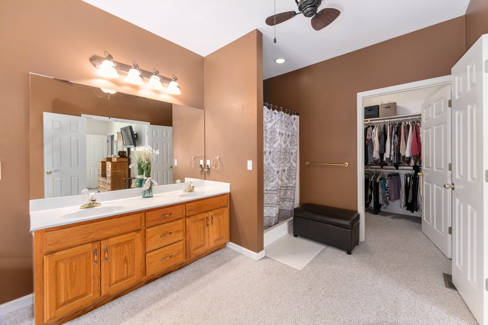 105 Spicer Road Burns, TN 37029 - Photo 22 of 44 a spacious bathroom with a double vanity sink and a mirror