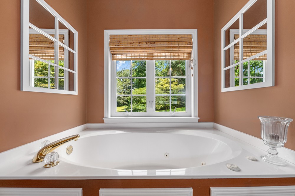 105 Spicer Road Burns, TN 37029 - Photo 23 of 44 a bathroom with bathtub and window