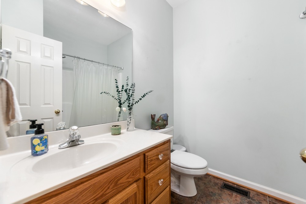 105 Spicer Road Burns, TN 37029 - Photo 25 of 44 a bathroom with a sink a toilet and a mirror