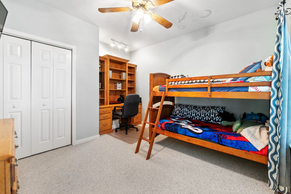 105 Spicer Road Burns, TN 37029 - Photo 26 of 44 a bedroom with bunk bed and a chandelier
