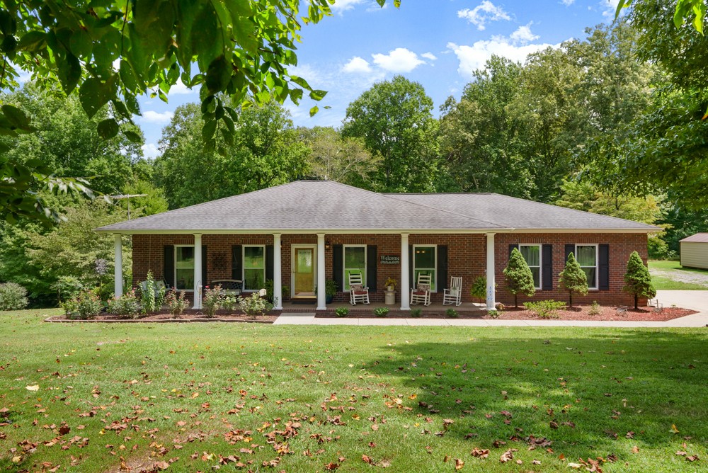 105 Spicer Road Burns, TN 37029 - Photo 5 of 44 a front view of house with yard and green space