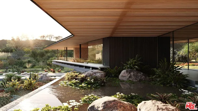 a swimming pool with outdoor seating and plants