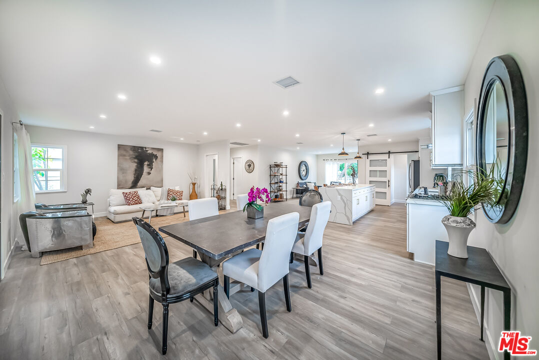 5619 Bellingham Avenue Valley Village, CA 91607 - Photo 13 of 48 a view of a dining room with furniture window and wooden floor